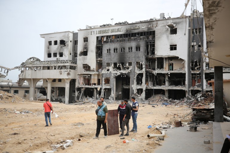 GAZA CITY, GAZA - MAY 11: A view of completely destroyed Shifa Hospital, which was raided by Israeli army, after number of mass graves found in the hospital in Gaza City, Gaza on May 11, 2024. The mass graves found in the hospitals raided by the Israeli army in the Gaza Strip increased to 7 and that the bodies of at least 520 Palestinians were exhumed from these mass graves. It was announced that the bodies of 49 Palestinians were exhumed from the third mass grave found in the Shifa Hospital in Gaza City, which was raided by the Israeli army. The Israeli army left behind a great destruction as a result of its attacks on Shifa Hospital, the largest health complex in the Gaza Strip, and its surroundings. (Photo by Dawoud Abo Alkas/Anadolu via Getty Images)