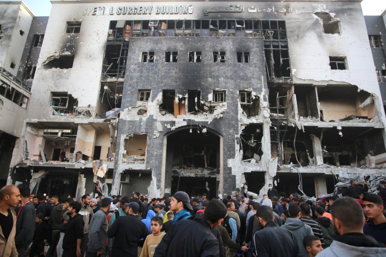 Palestinians inspect the damage outside Gaza's Al-Shifa hospital after the Israeli military withdrew from the complex housing the hospital on April 1, 2024, amid the ongoing battles Israel and the Hamas militant group. (Photo by AFP)