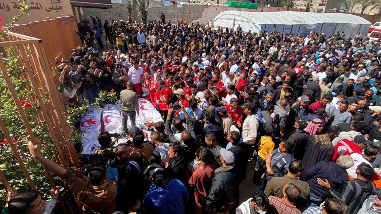 FILE PHOTO: Palestinians mourn medics, who came under Israeli fire while on a rescue mission, after their bodies were recovered, according to the Red Crescent, at Nasser hospital in Khan Younis in the southern Gaza Strip March 31, 2025. REUTERS/Hatem Khaled/File Photo