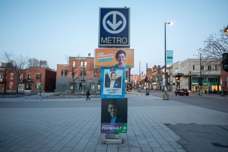 Election signs for various political parties line the streets in Montreal ahead of the opening of polls in Canada's federal election on April 28, 2025.