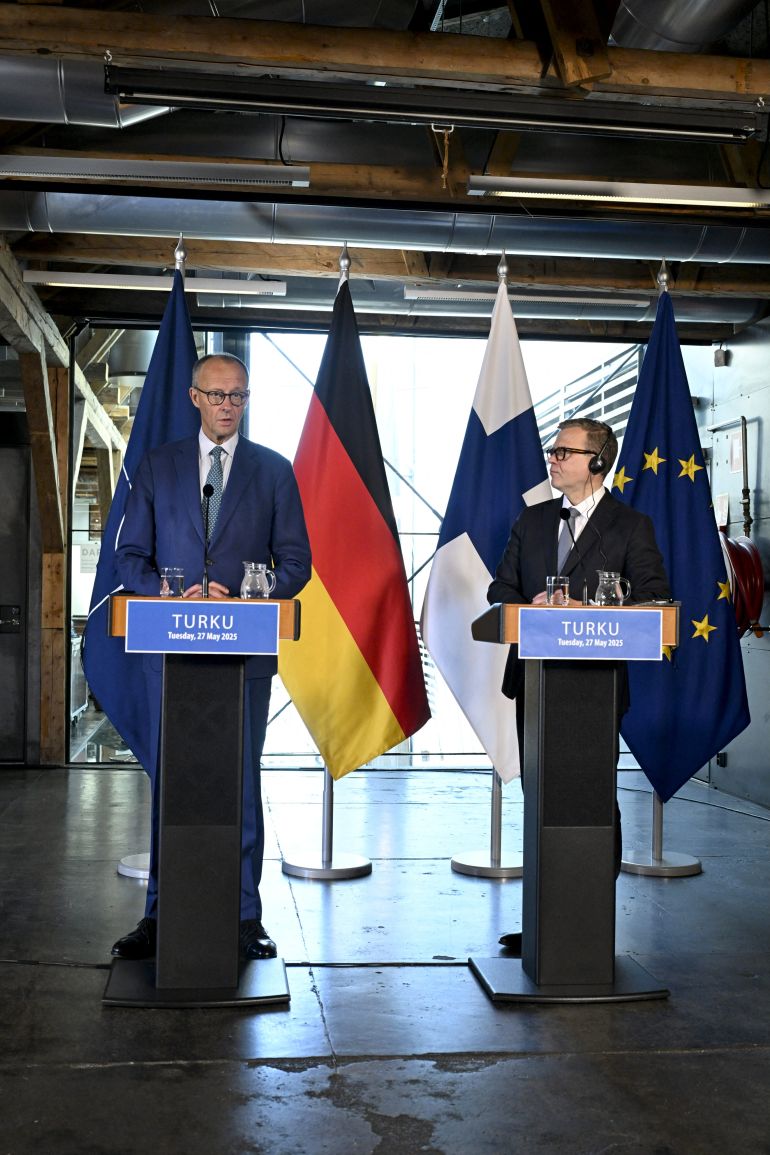 German Chancellor Friedrich Merz (L) and Finnish Prime Minister Petteri Orpo give a joint press conference during the Nordic Prime Ministers' Summer Meeting in Turku, Finland, on May 27, 2025. (Photo by Roni Rekomaa / LEHTIKUVA / AFP) / FINLAND OUT
