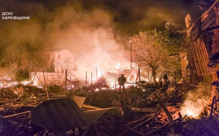In this photo provided by the Ukrainian Emergency Service, firefighters put out a fire following a Russian drone attack that hit apartment buildings in Kharkiv, Ukraine, Wednesday, April 30, 2025. (Ukrainian Emergency Service via AP)