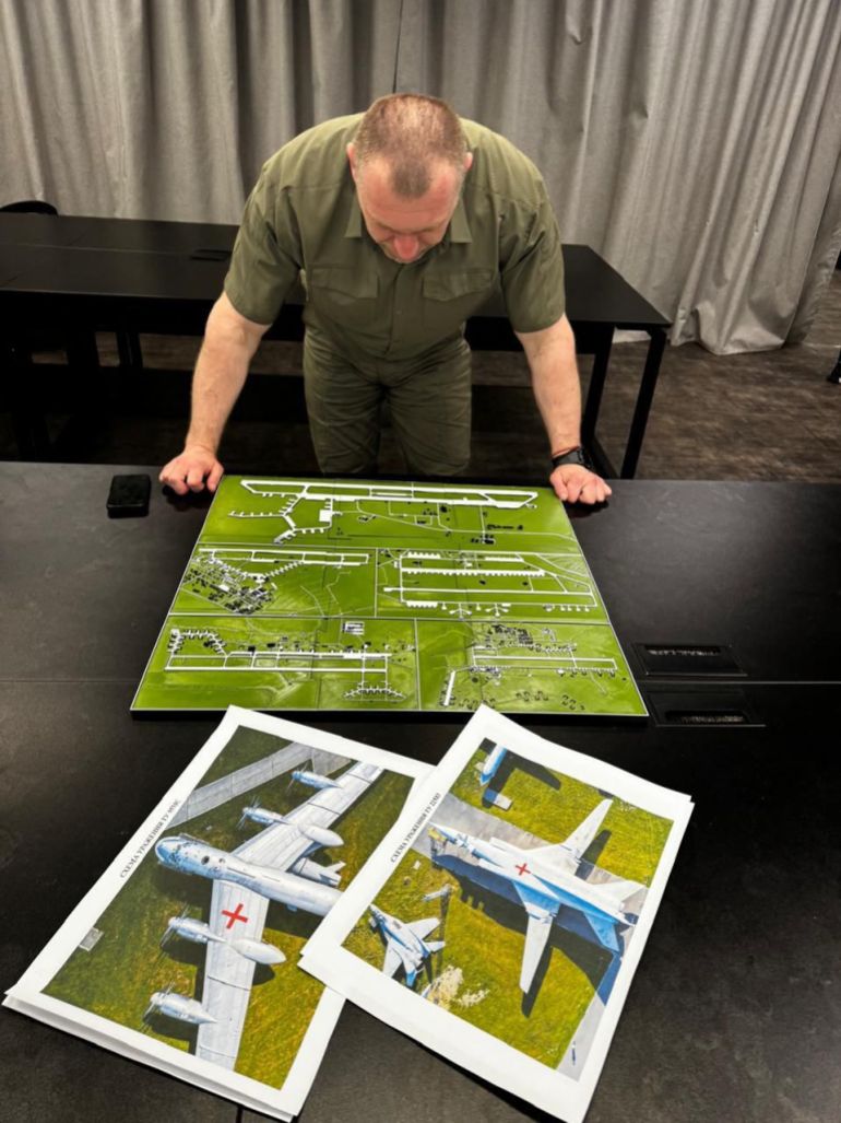 This undated and unlocated handout picture, released on June 1, 2025 by the Security Service of Ukraine shows Head of Ukraine’s Security Service Vasyl Malyuk looking at a map showing a Russian military aircraft base, amid the Russian invasion of Ukraine.