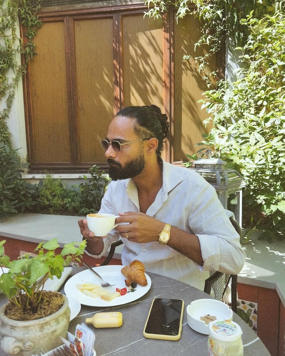 May be an image of 1 person, beard and coffee cup