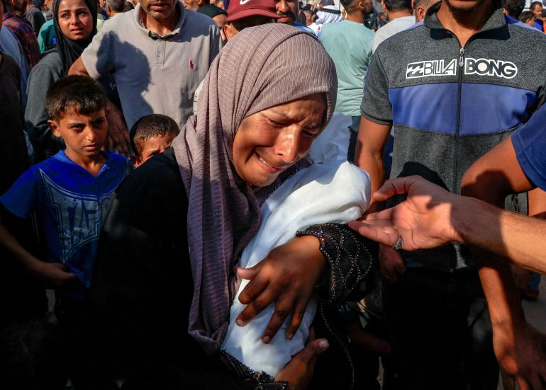 FILE PHOTO: Palestinian mother Alaa Al-Najjar mourns her three-month-old baby Yehia, who died due to malnutrition amid a hunger crisis, according to medics, at Nasser Hospital in Khan Younis, in the southern Gaza Strip July 20, 2025. REUTERS/Hatem Khaled/File Photo