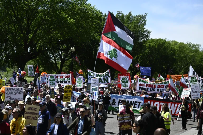 Demonstrators attend a May Day rally marking International Workers' Day in Washington, DC on May 1, 2026. (Photo by Kent NISHIMURA / AFP)